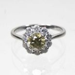 An 18 carat white gold yellow diamond cluster ring