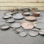 Two trays of antique copper pans