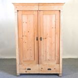 An early 20th century continental pine armoire
