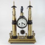 A bronze mounted mantel clock