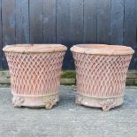 A pair of large terracotta planters