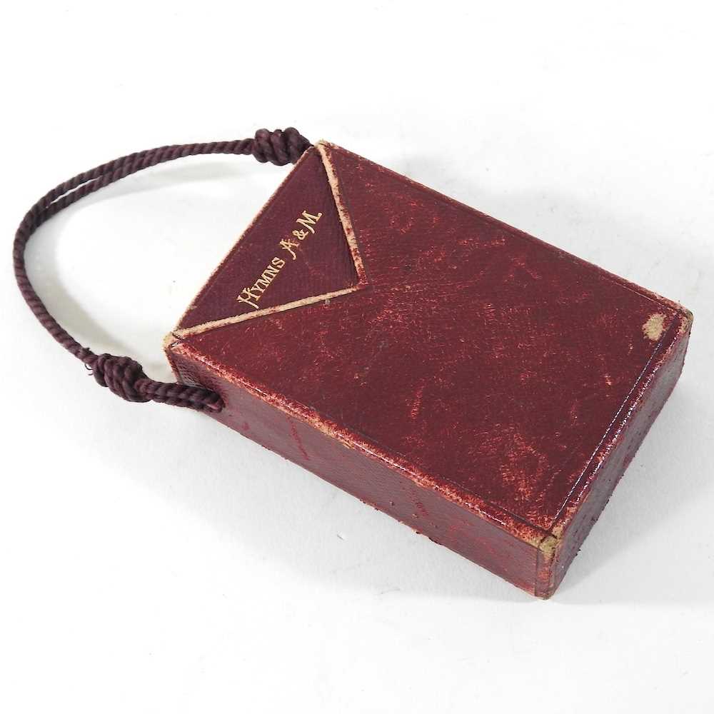 A leather bound book of hymns