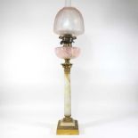An early 20th century onyx oil lamp