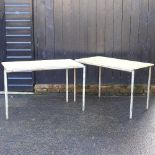 A pair of metal tables