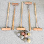 A collection of wooden croquet mallets