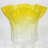 A yellow glass oil lamp shade