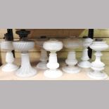 A collection of seven glass lamp bases