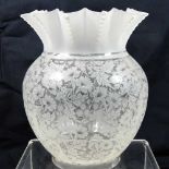 A clear glass oil lamp shade