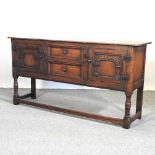 A 20th century carved oak sideboard
