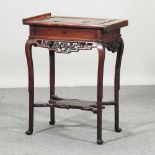 A late 19th century Chinese rosewood work table
