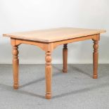 A modern light oak dining table