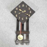 An Art Deco oak cased wall clock