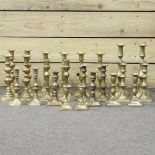 Twelve pairs of brass candlesticks