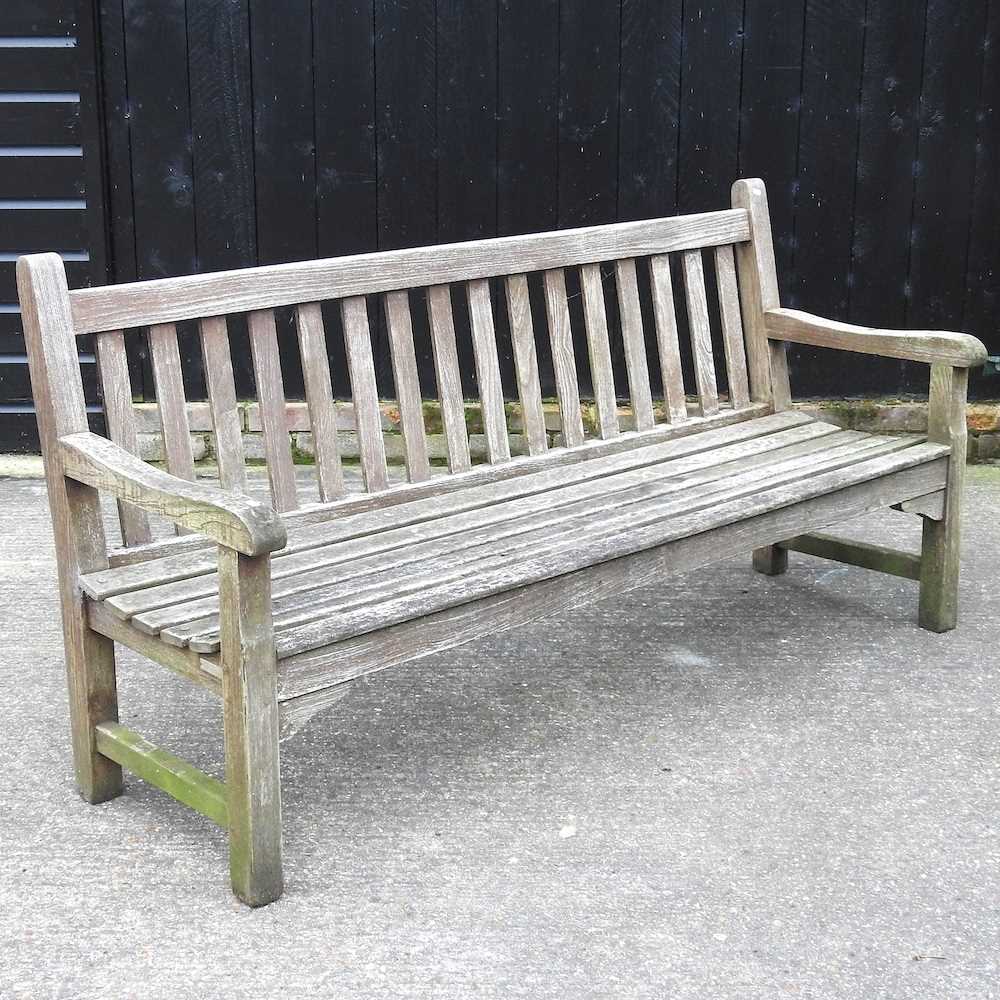 A hardwood slatted garden bench