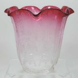 A red and clear glass oil lamp shade