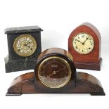 A collection of three mantel clocks