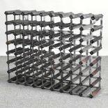 A metal and wooden wine rack