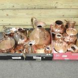 A collection of copper saucepans