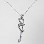 An 18 carat white gold and diamond pendant