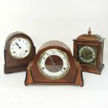 A collection of three mantel clocks