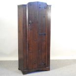 A 1920's oak hall cupboard