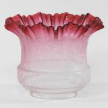 A pink glass oil lamp shade