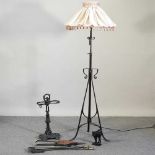 A black painted iron standard lamp
