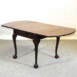 A 1920's draw leaf dining table