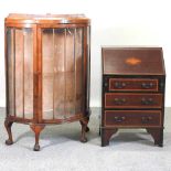 A 1920's walnut display cabinet