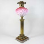 A brass column oil lamp