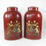 A pair of red tole style canisters