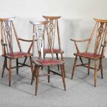 A set of four Ercol style dining chairs