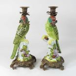 A pair of continental porcelain candlesticks