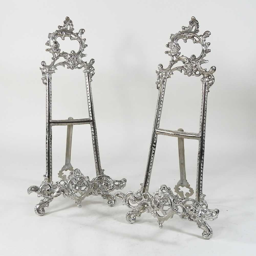 A pair of silvered metal easels