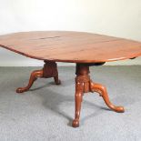 A fruitwood dining table