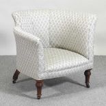 A Victorian tub shaped armchair