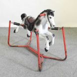 A vintage metal rocking horse