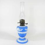 A blue opaque glass oil lamp