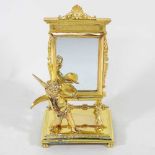 A miniature gilt mirror