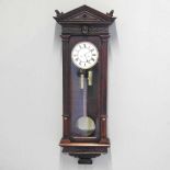 A late 19th century regulator wall clock
