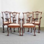 A set of four Chippendale style carver chairs