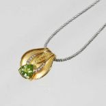 An 18 carat gold, peridot and diamond necklace