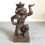 A bronzed figural stand