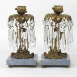 A pair of gilt metal candlesticks