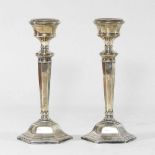 A pair of silver table candlesticks