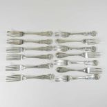 A collection of silver table forks