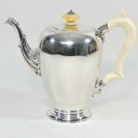 A Garrards silver coffee pot