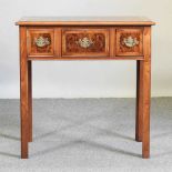 A walnut lowboy