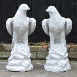 A pair of reconstituted stone eagles