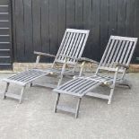 A pair of teak steamer chairs